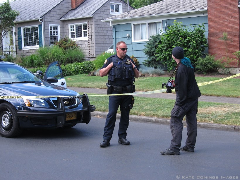 Mike BlueHair talking to policeman
